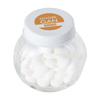 Small glass jar with mints with dextrose mints in White