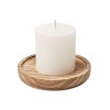 Candle on round wooden base in Brown