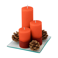 Set of three pillar candles in different sizes: ø 5x7,5 cms,  ø 5x10 cms and ø 5x15 cms, includes a clear glass plate and three decorative pine cones; presented in a colourful gift