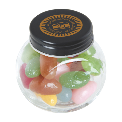 Small glass jar with jelly beans in 
